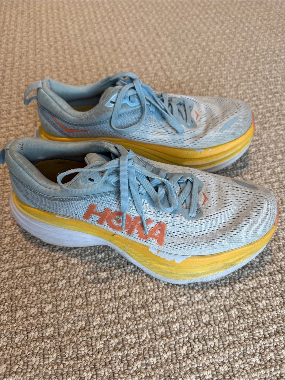Hoka Light Blue Running Shoes with Yellow and Coral Accents